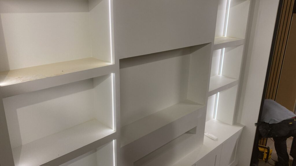 a white shelves with lights