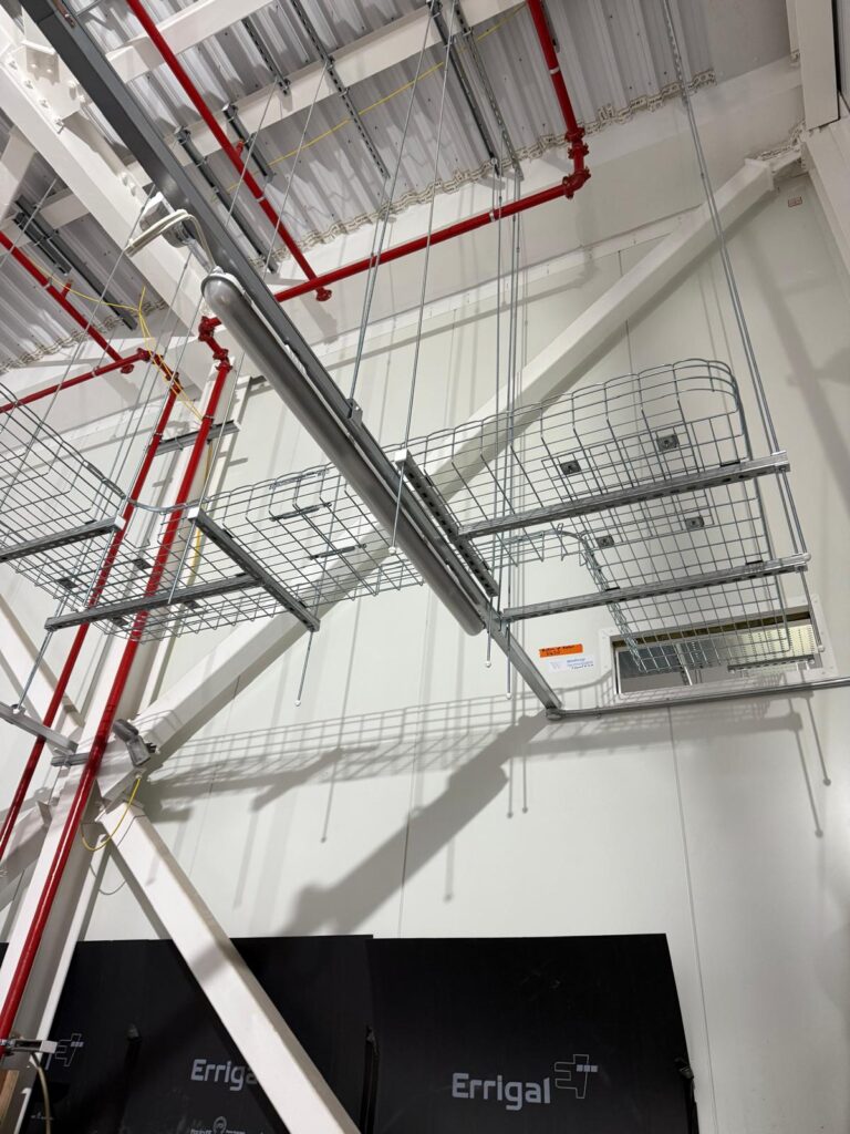 a metal pipes and a basket from a ceiling